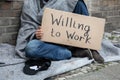 Homeless Man Holding Cardboard With Text Willing To Work