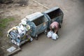 KYIV, UKRAINE MARCH 31, 2019: A homeless man looking for food in a garbage dumpster. Urban Poverty