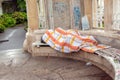 A homeless man in one of the parks of the city of Vienna sleeps on a bench