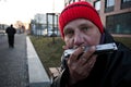 Homeless man playing harmonica