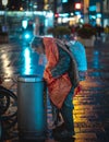 Homeless man in rainy night