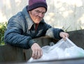 Homeless Man - Roots In Dumpster Royalty Free Stock Photo