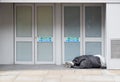 Homeless Man in Shop Doorway