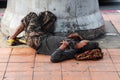 Homeless man sleep on pavement Royalty Free Stock Photo