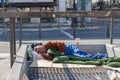 Homeless man sleeping on the air vent of metro. Royalty Free Stock Photo