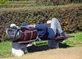 Homeless man is sleeping on a bench Royalty Free Stock Photo