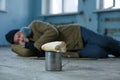 Homeless man sleeping on the cardboard