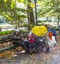 Homeless man sleeping in central park in Manhattan Royalty Free Stock Photo