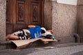 Homeless man sleeping at the church entrance