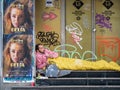 Homeless man sleeping on the street in the center of Bucharest