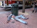 Homeless man sleeps on ground resting