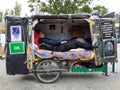 Homeless man sleeps in his movable home