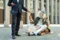 Homeless man smiling while feeling help and support