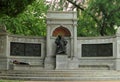 A homeless man taking a nap on the bench of Samuel Hahnemann Monument