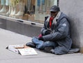 Homeless man at 5th Avenue in Midtown Manhattan Royalty Free Stock Photo