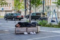Homeless men sleeping on a bench in Dotonbori area Royalty Free Stock Photo