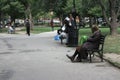 Homeless men and women in a city park