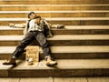 Homeless man sleeping on stairs Royalty Free Stock Photo