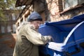 Homeless old man in search for food. Royalty Free Stock Photo