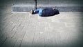 Homeless person asleep on street Royalty Free Stock Photo