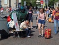 Homeless person and tourists in Lille, France