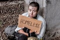 Homeless poor woman with sign Royalty Free Stock Photo