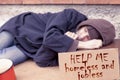 Homeless sleeping on a cardboard Royalty Free Stock Photo