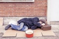 Homeless sleeping on a cardboard