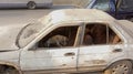 A homeless street dog is sleeping inside damaged car beside street of Dhaka, Bangladesh