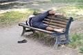 Homeless taking a resti on a bench