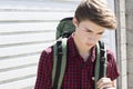 Unhappy Homeless Teenage Boy On The Streets With Rucksack Royalty Free Stock Photo