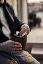 Closeup photo of beggar hands getting money Royalty Free Stock Photo