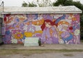 Homeless woman with chinese theme by Brent Ozaeta & SM Sanz for Wild West Mural Fest 2020 in West Dallas, Texas.