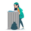 Homeless woman in dirty clothes standing at the trash can