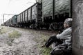 Homeless woman near the rail track