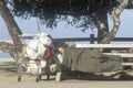 Homeless woman sleeping with shopping cart possessions, Santa Monica, California