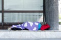 Homeless woman sleeps on the street Royalty Free Stock Photo