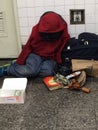 Homeless woman in subway on 34th street in NYC