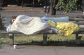 Homeless women sleeping on bench, Washington D.C.