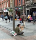 Homeless young man begging in Dublin Royalty Free Stock Photo