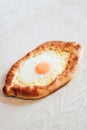 Homemade Ajarian Khachapuri with Suluguni Cheese Filled with a Egg and Melted Butter Close Up