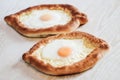 Homemade Ajarian Khachapuri with Suluguni Cheese Filled with a Egg and Melted Butter Close Up
