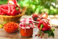 Homemade ajvar in glass jar on table Royalty Free Stock Photo