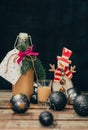 Homemade alcohol egg liquere with jar, candle, snowman and christmas ball decoration on wood table Royalty Free Stock Photo