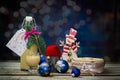 Homemade alcohol egg liquere with jar, candle and snowman decoration on wood table with bokeh Royalty Free Stock Photo