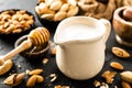 Homemade almond milk in jug. Almond milk and almonds