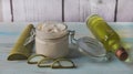 Homemade Aloe Vera cream in a glass jar, with cut aloe leaves