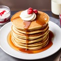 Homemade American pancakes with honey, caramel sauce or syrup with fresh blueberries, raspberries and strawberries on a