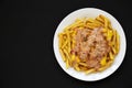 Homemade Animal Style French Fries on a white plate on a black background, top view. Flat lay, overhead, from above. Space for Royalty Free Stock Photo