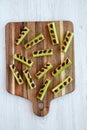 Homemade ants on a log with celery, peanut butter and raisins on a wooden board, top view Royalty Free Stock Photo